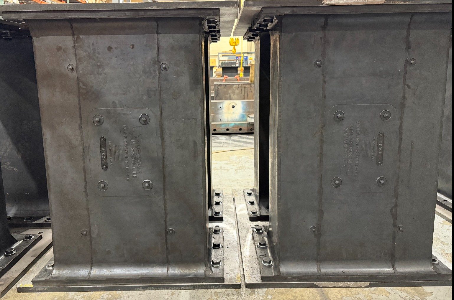 Two Buckling Column Fenders with embossed Duramax Infrastructure plates on the Hiram, Ohio production floor