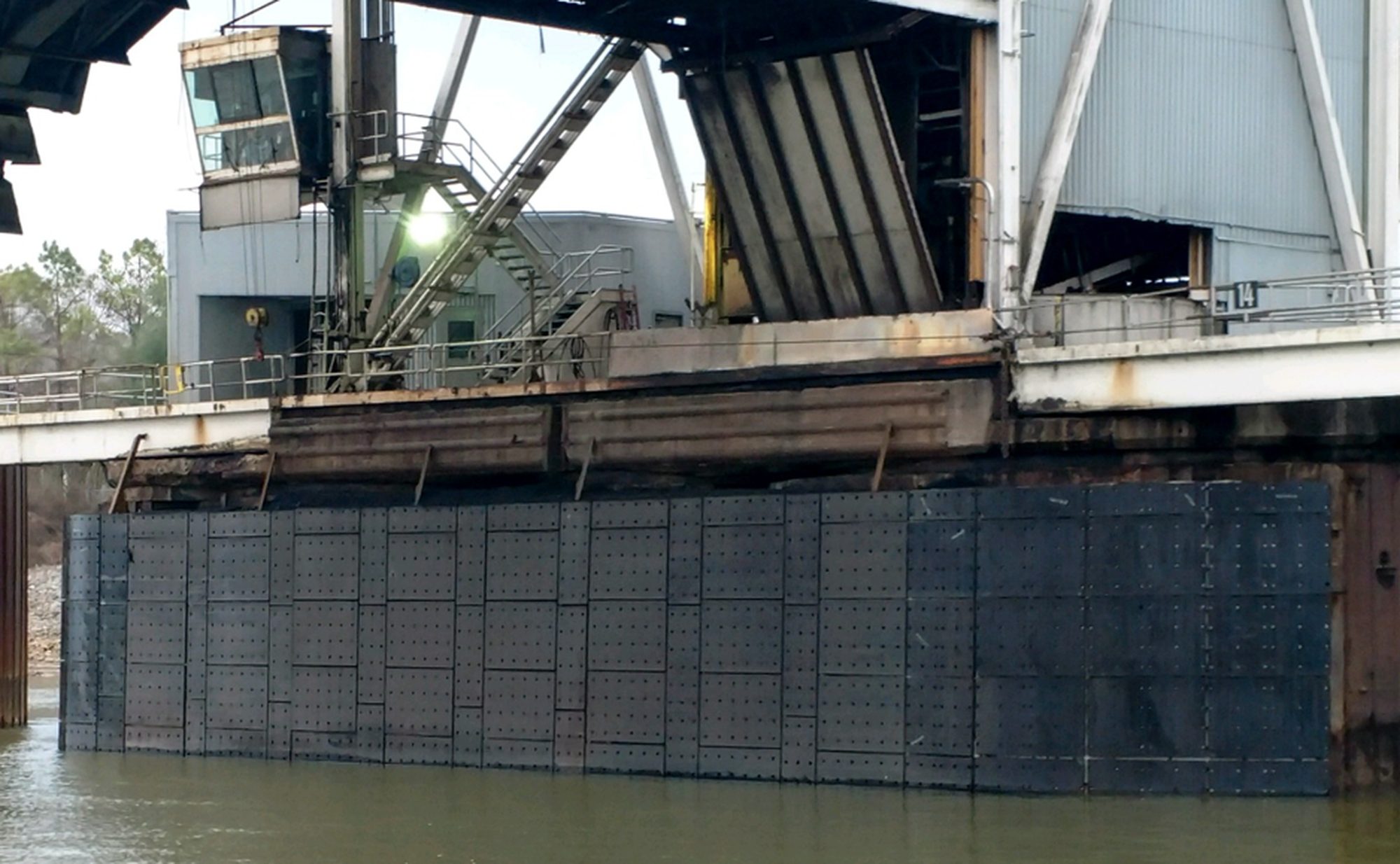Heavy rubber dock fender wall protecting a working terminal