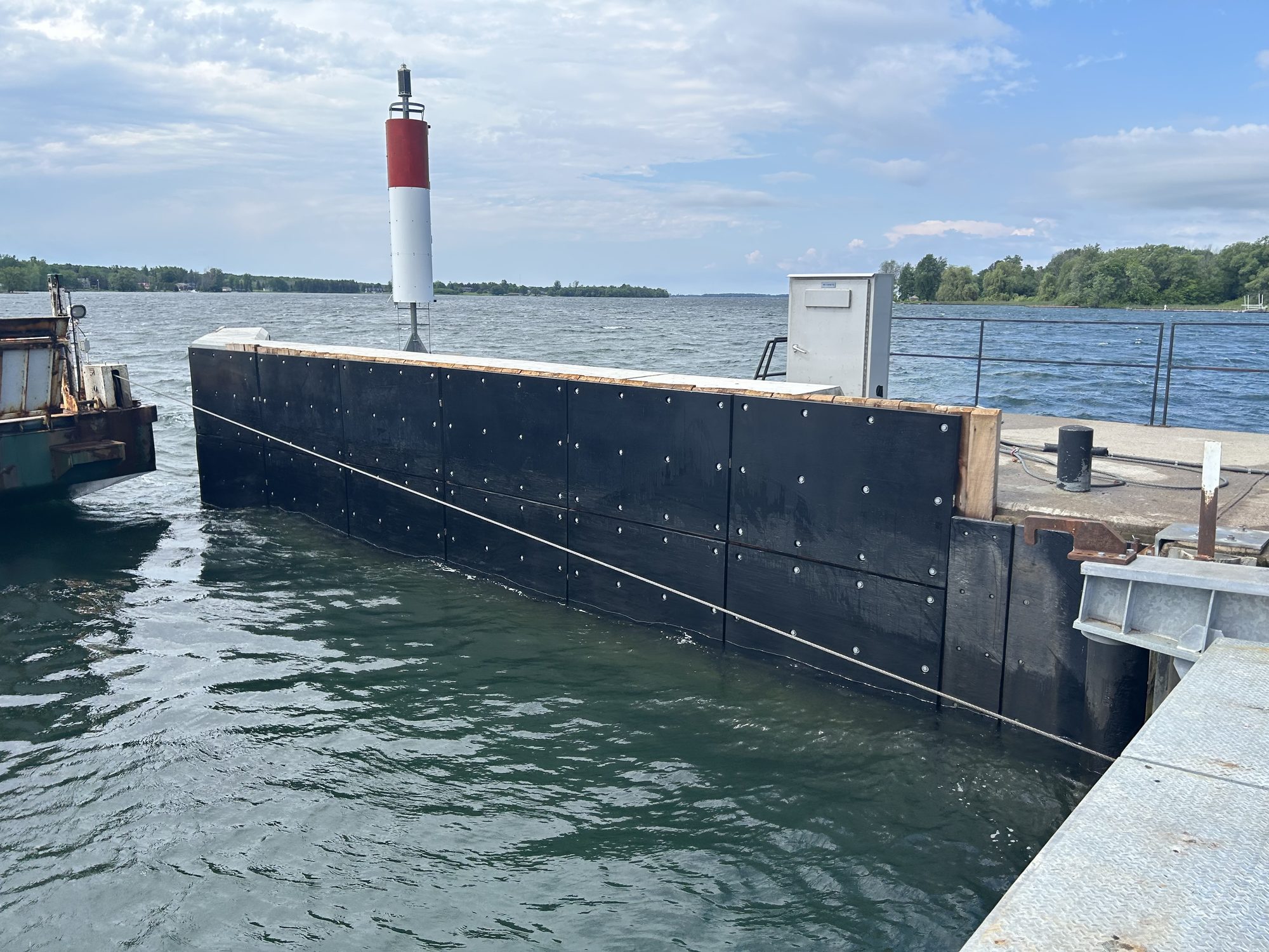 LINERITE composite batterboard installed on a working dock face over water